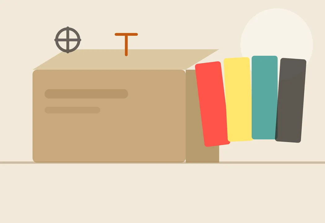 Caja de cartón abierta con pliegos de cartoncillo de colores cortados al formato de máquina